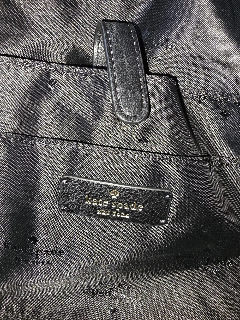 kate spade black tote with gold-tone logo and zipper